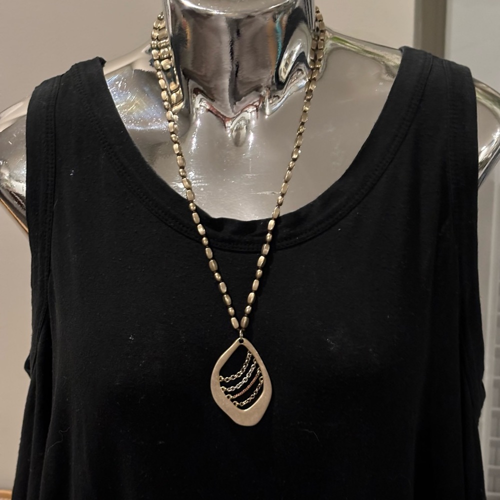 Kenneth Cole beaded necklace with large abstract pendant in great condition!